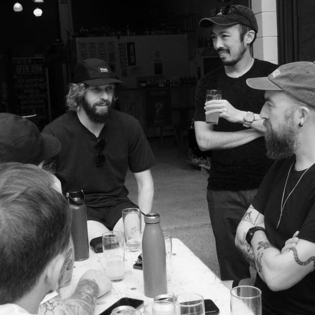 Beer Jerk Run Club runners having beers after a run.
